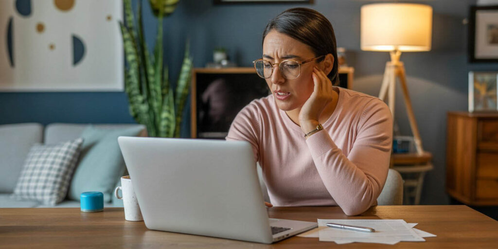 Taxpayer checking IRS account online to confirm how to pay back taxes owed