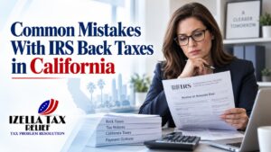 San Mateo County homeowner organizing old tax records after learning about frequent IRS back taxes mistakes California residents run into